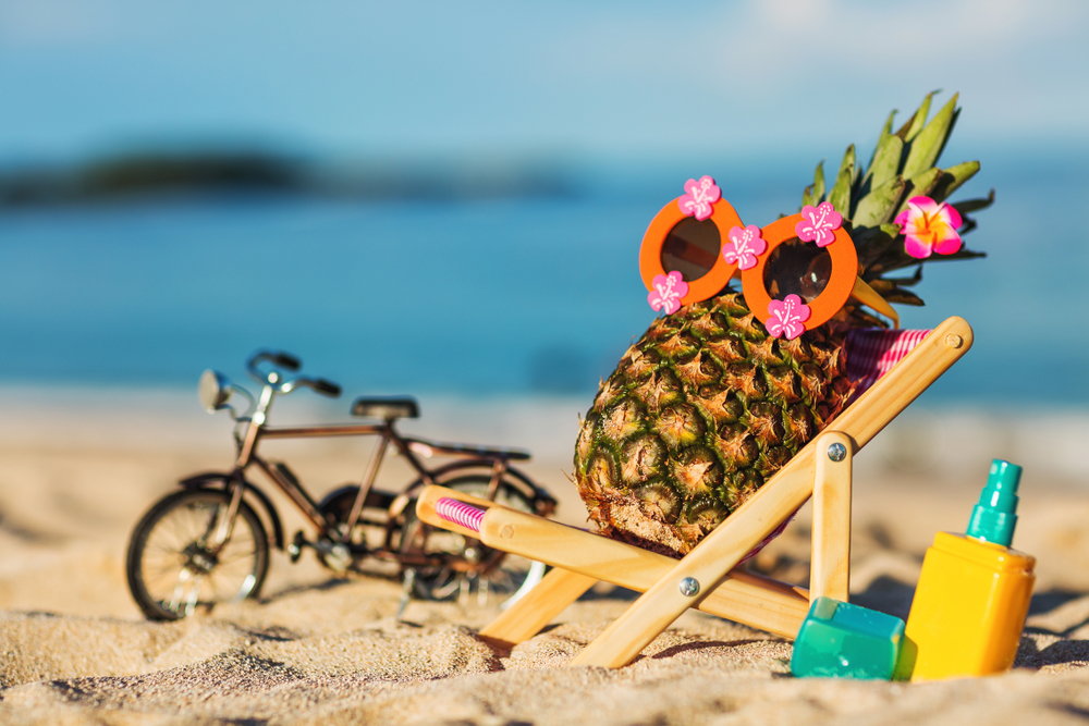 Ripe,Attractive,Girl-pineapple,Lying,On,Sun,Chair,On,The,Sand