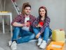 young-couple-doing-repairs-have-break-time-with-cup-tasty-coffe