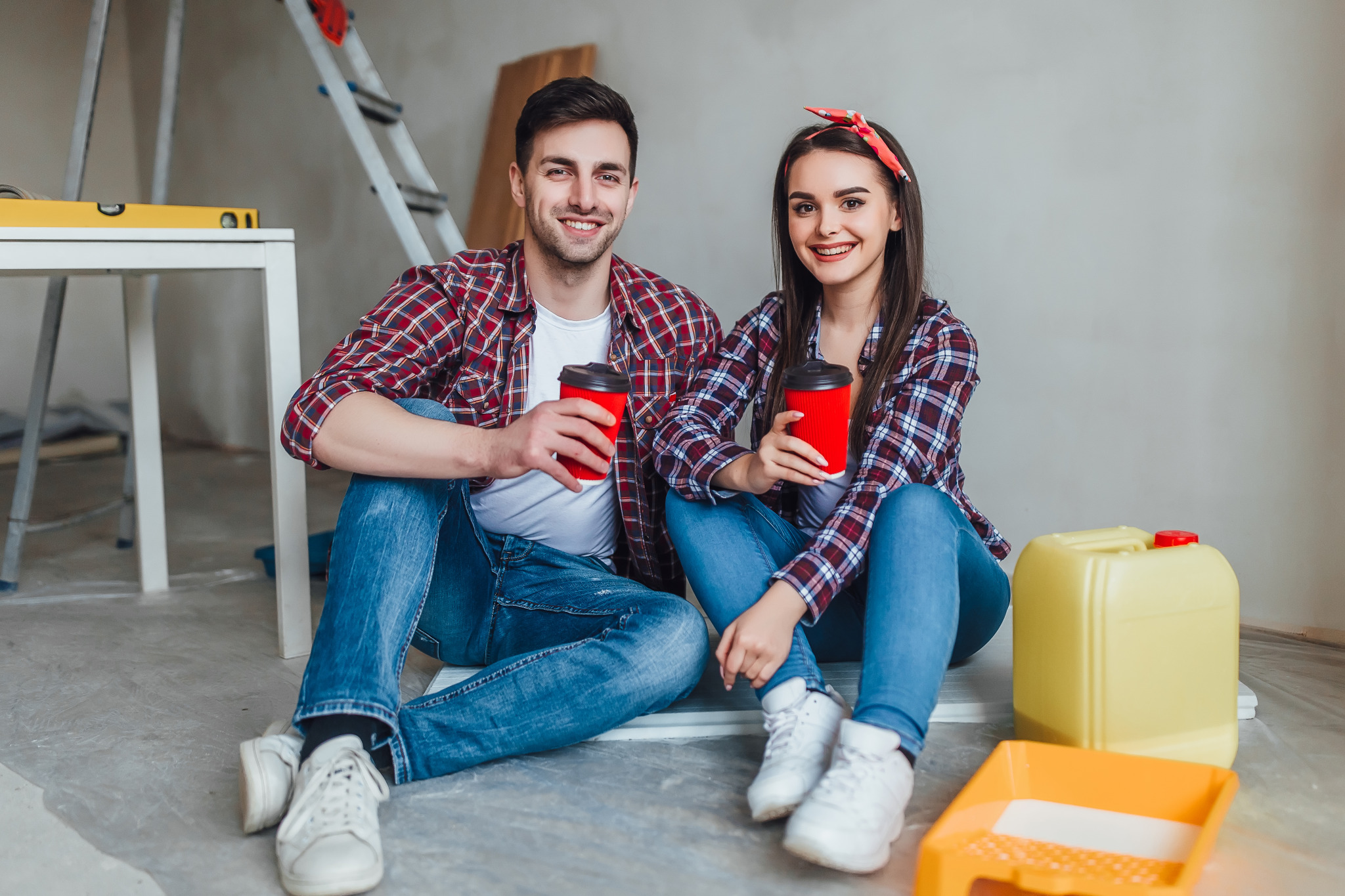 young-couple-doing-repairs-have-break-time-with-cup-tasty-coffe