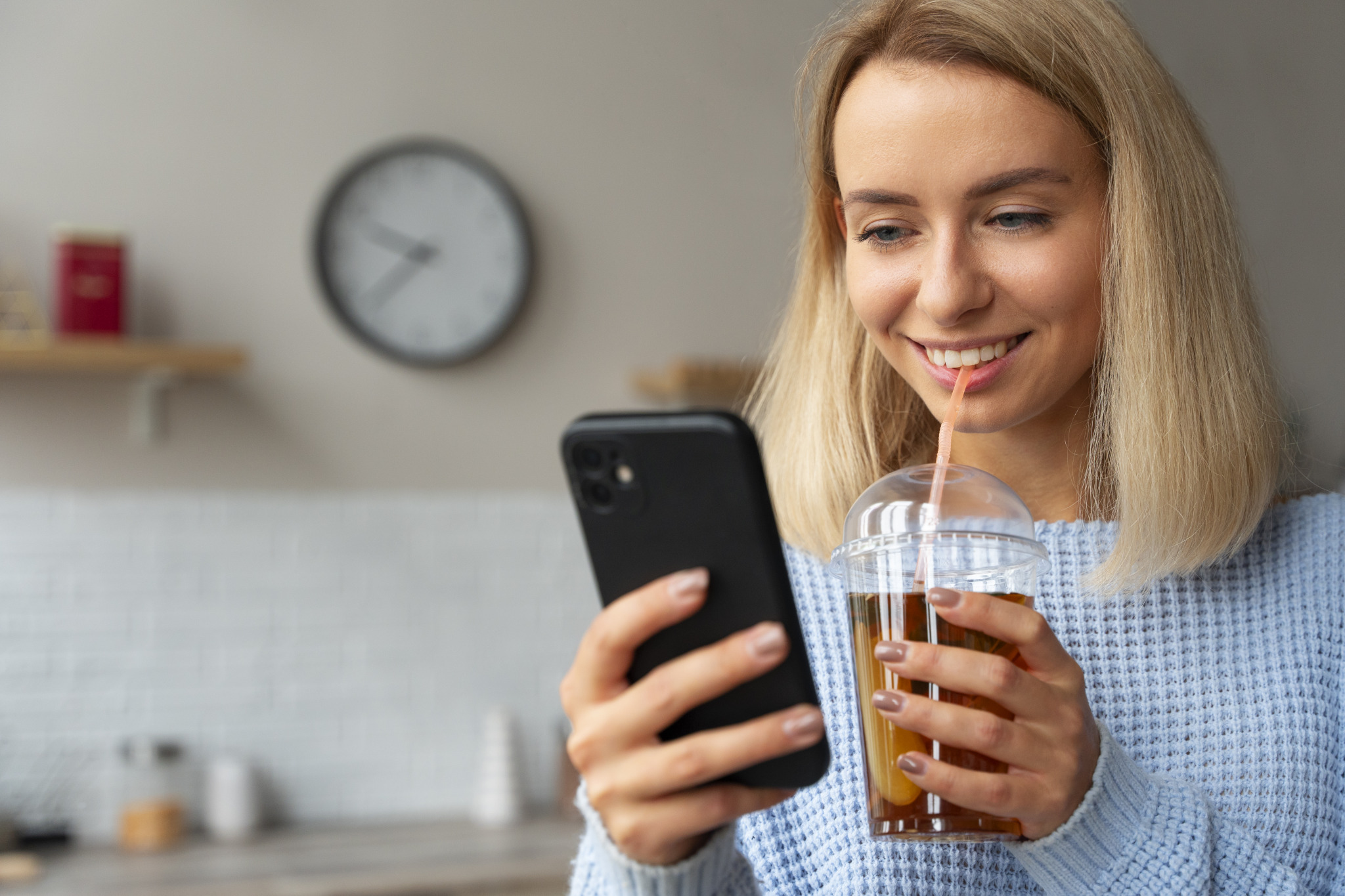 medium-shot-woman-holding-smartphone