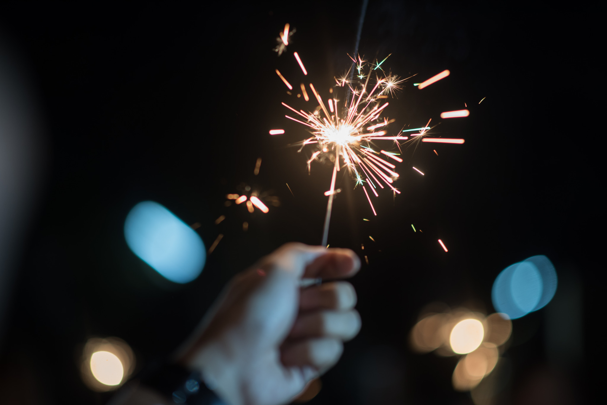 hand-holding-burning-sparkler-light